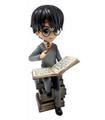 Figura Harry Potter Pila de Grimorios Wizarding World